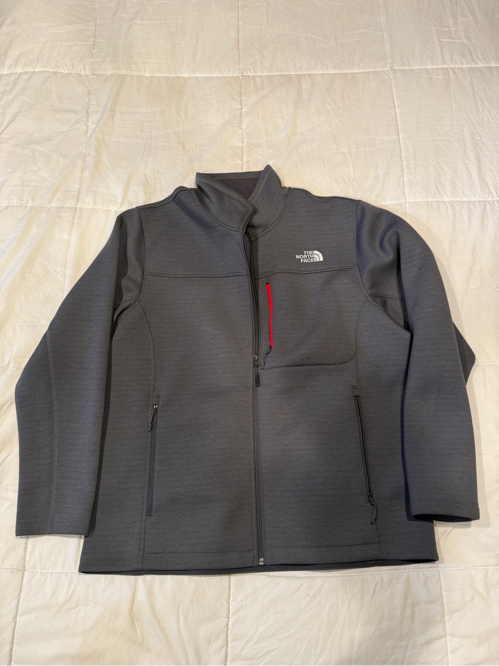 The North Face Men's Dark Gray Lightweight Jacket with Red Zip Accent